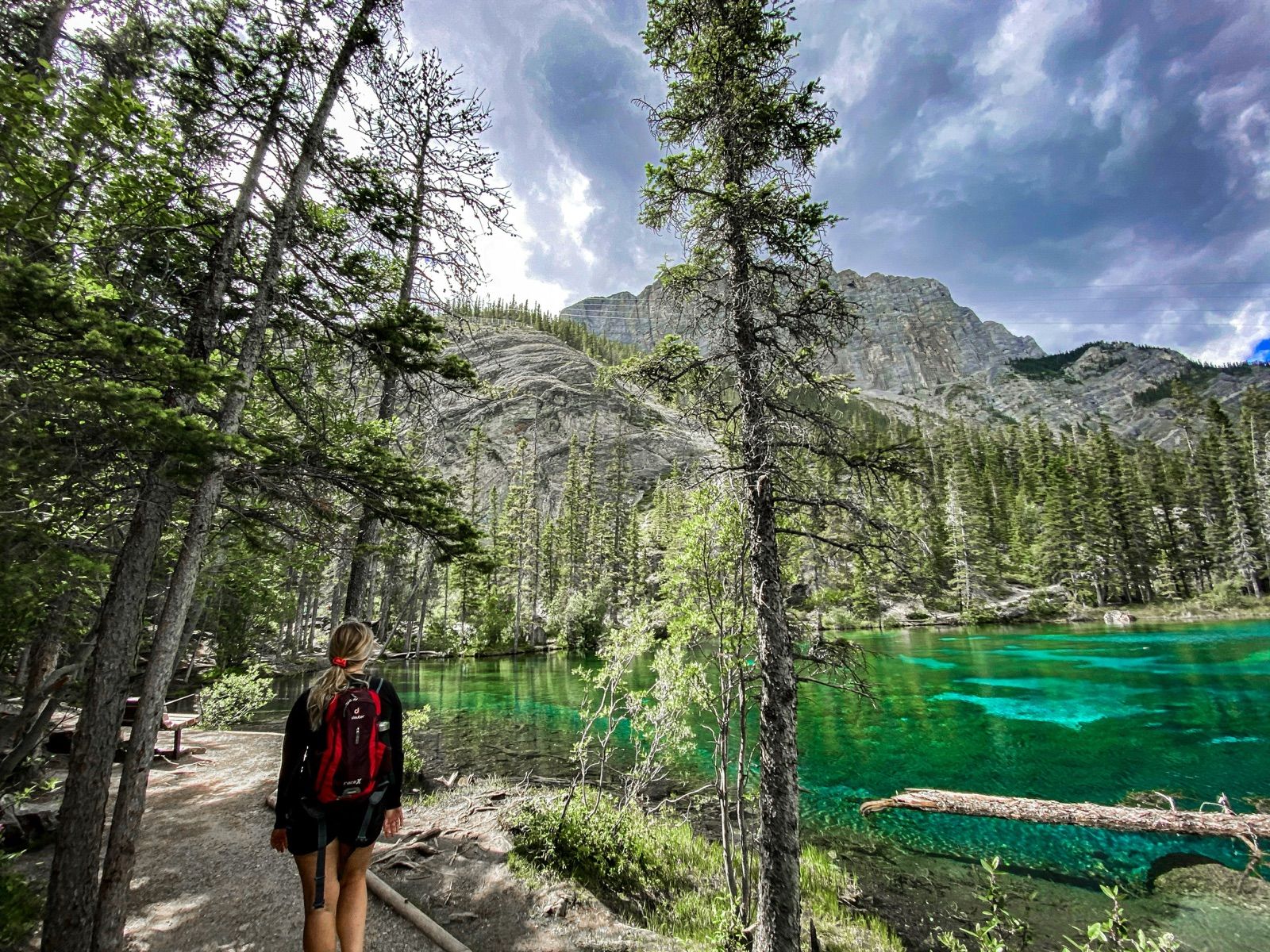 Hiker taking in the view at Grassi Lakes — Banff Journey Grassi Lakes & Grotto Canyon hike